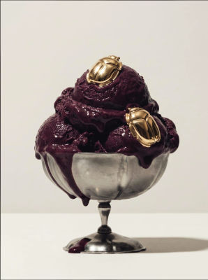 AI-generated image of purple ice cream in a silver bowl with gold scarab beetles