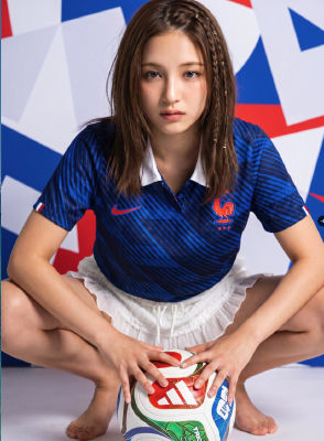 AI-generated image of a woman in a France national team jersey with a soccer ball