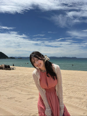 Deepfake of Zhao Jiamin on a beach