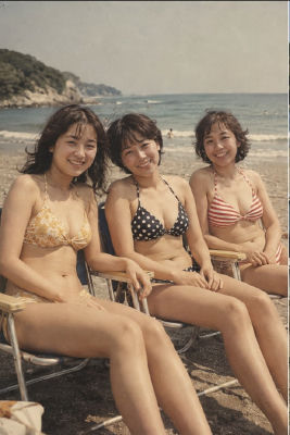 AI-generated image of an unidentified women in bikinis at a beach