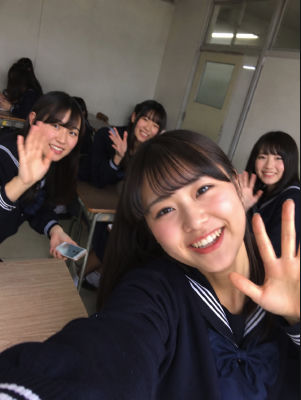 AI-generated photo of young woman in a classroom selfie