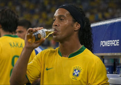 AI-generated image of Ronaldinho drinking Corona at a Brazil match