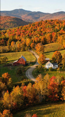AI-generated autumn landscape with red barn and farmhouse