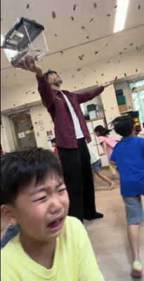 AI-generated image of a man releasing insects above a crying child