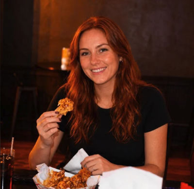 AI-generated image of Kate Jenkinson eating at a restaurant