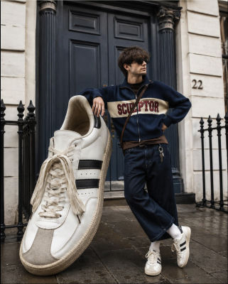 AI-generated image of Alfie Templeman in 'SCULPTOR' sweater outside a London doorway