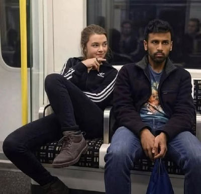 AI-generated image of Maisie Williams and a man resembling Abhishek Yadav seated on a train