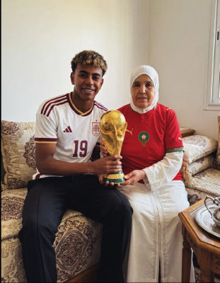 AI-generated image of a Lamine Yamal and an older woman holding the World Cup trophy