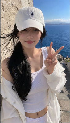 AI-generated selfie of an unidentified woman in a coastal setting