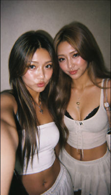 AI-generated photo of two women in crop tops posing together