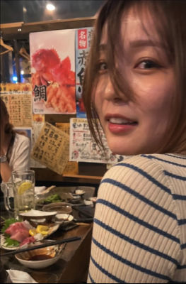AI-generated selfie at a Japanese izakaya
