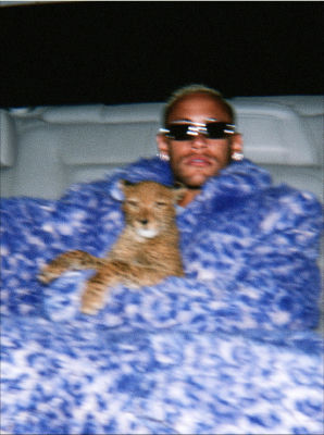 AI-generated image of Neymar holding a ginger cat in a blue fur coat