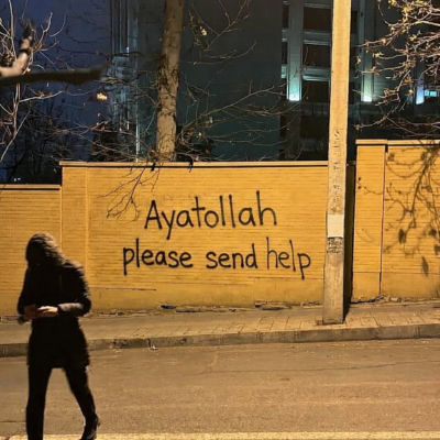 AI-generated image of Donald Trump beside 'Ayatollah please send help' graffiti