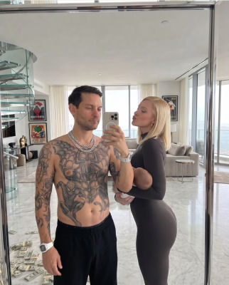 AI-generated image of Tobey Maguire and a woman in a luxury apartment mirror selfie
