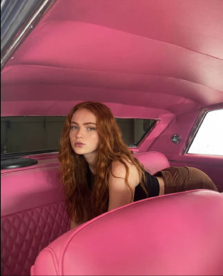 AI-generated image of Sadie Sink in a pink car interior