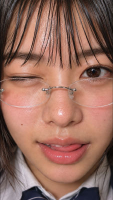 AI-generated close-up selfie of an unidentified young woman in a school uniform