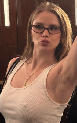 AI-generated image resembling Erin Moriarty in a tank top and glasses