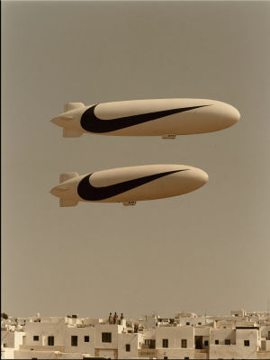 AI-generated image of Nike-branded airships over a city