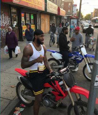 AI-generated image of LeBron James, Adrien Broner, and Ian Kinsler on dirt bikes in an urban street