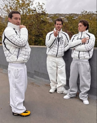 AI-generated image of Tobey Maguire, Tom Holland, and Andrew Garfield in matching Spider-Man puffer jackets