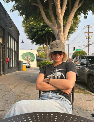 AI-generated image of an unidentified woman at a sidewalk café
