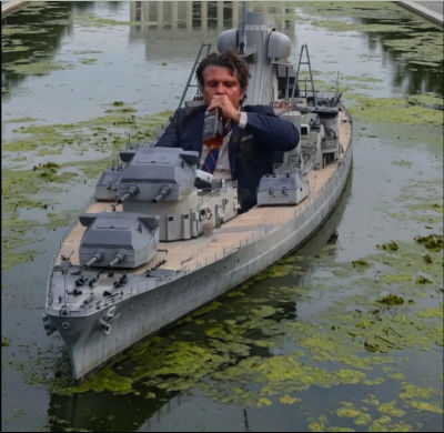 AI-generated image of a man drinking from a flask atop a battleship in an algae pond
