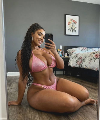 AI-generated image of a woman in a pink bikini taking a mirror selfie