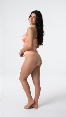 AI-generated image of Charli D'Amelio in peach lingerie set