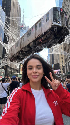 AI-generated image of woman taking selfie in Times Square with floating subway train