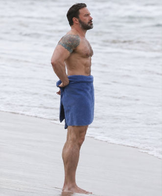 AI-generated image of Ben Affleck on a beach in a towel
