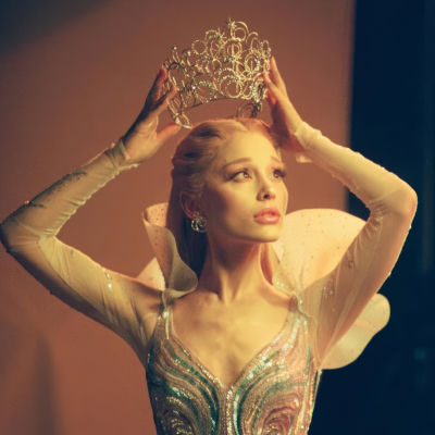 Deepfake of Ariana Grande in a jeweled tiara and beaded corset costume