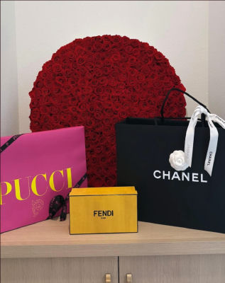 AI-generated image of Chanel, Fendi, and Pucci luxury brand packaging display