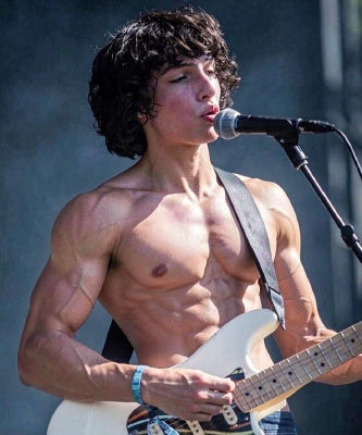 Deepfake image of Finn Wolfhard performing shirtless on stage