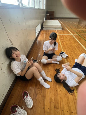 AI-generated image of three school-age girls in a gymnasium