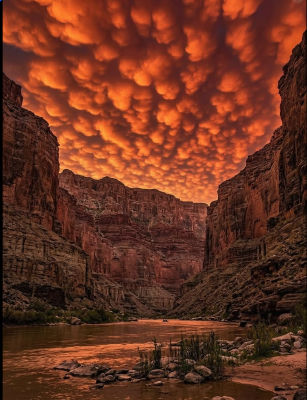 AI-generated image of a canyon with mammatus clouds over a river at sunset