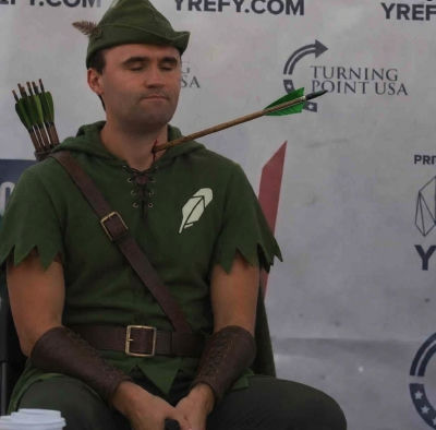 AI-generated image of Charlie Kirk in Robin Hood costume with an arrow through his neck at a Turning Point USA event