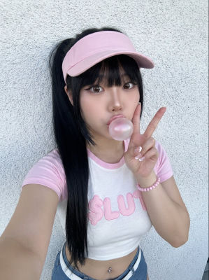 AI-generated selfie of a young woman blowing a pink bubblegum bubble