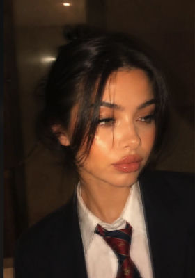 AI-generated portrait of an unidentified woman in a blazer and tie
