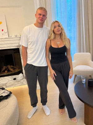 AI-generated image of Erling Haaland with an unidentified woman in a living room