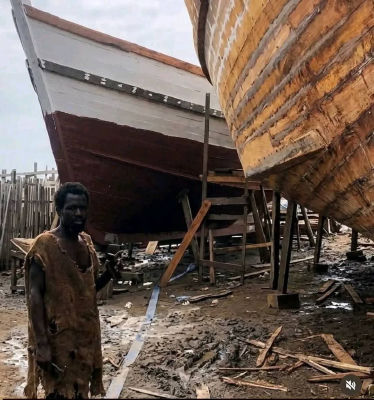 AI-generated image of Ebo Noah at a wooden boat-building yard