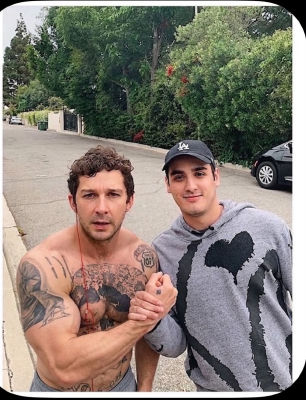 AI-generated image of Shia LaBeouf shirtless alongside another man on a residential street