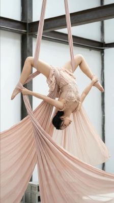 AI-generated image of a woman performing aerial silk dance