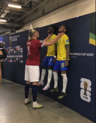 AI-generated image of Erling Haaland posing playfully with a Neymar FIFA World Cup mural