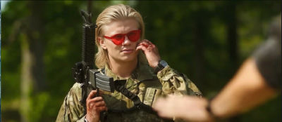 AI-generated image of Erling Haaland in camouflage attire holding a rifle