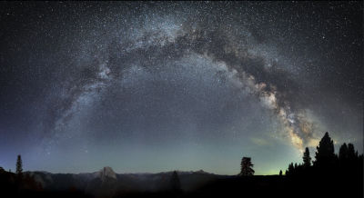 AI-generated Milky Way panorama over mountain landscape