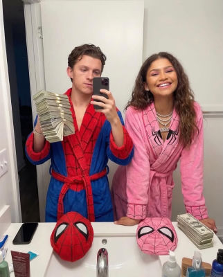 AI-generated image of Zendaya and Tom Holland in Spider-Man robes taking a mirror selfie with cash