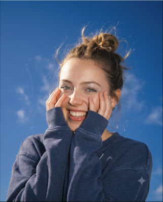 AI-generated portrait of an unidentified woman against a blue sky