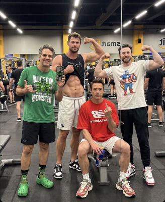 AI-generated image of Robert Downey Jr., Chris Hemsworth, Chris Evans, and Mark Alan posing in a gym