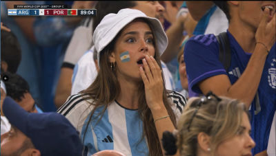 AI-generated image of woman at fabricated Argentina vs Portugal World Cup 2022 scoreboard
