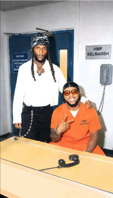 AI-generated image of Burna Boy in an HMP Belmarsh jumpsuit during a prison visit